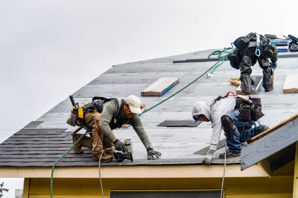 Professional Emergency Roof Repair technician working in Elwood, NY